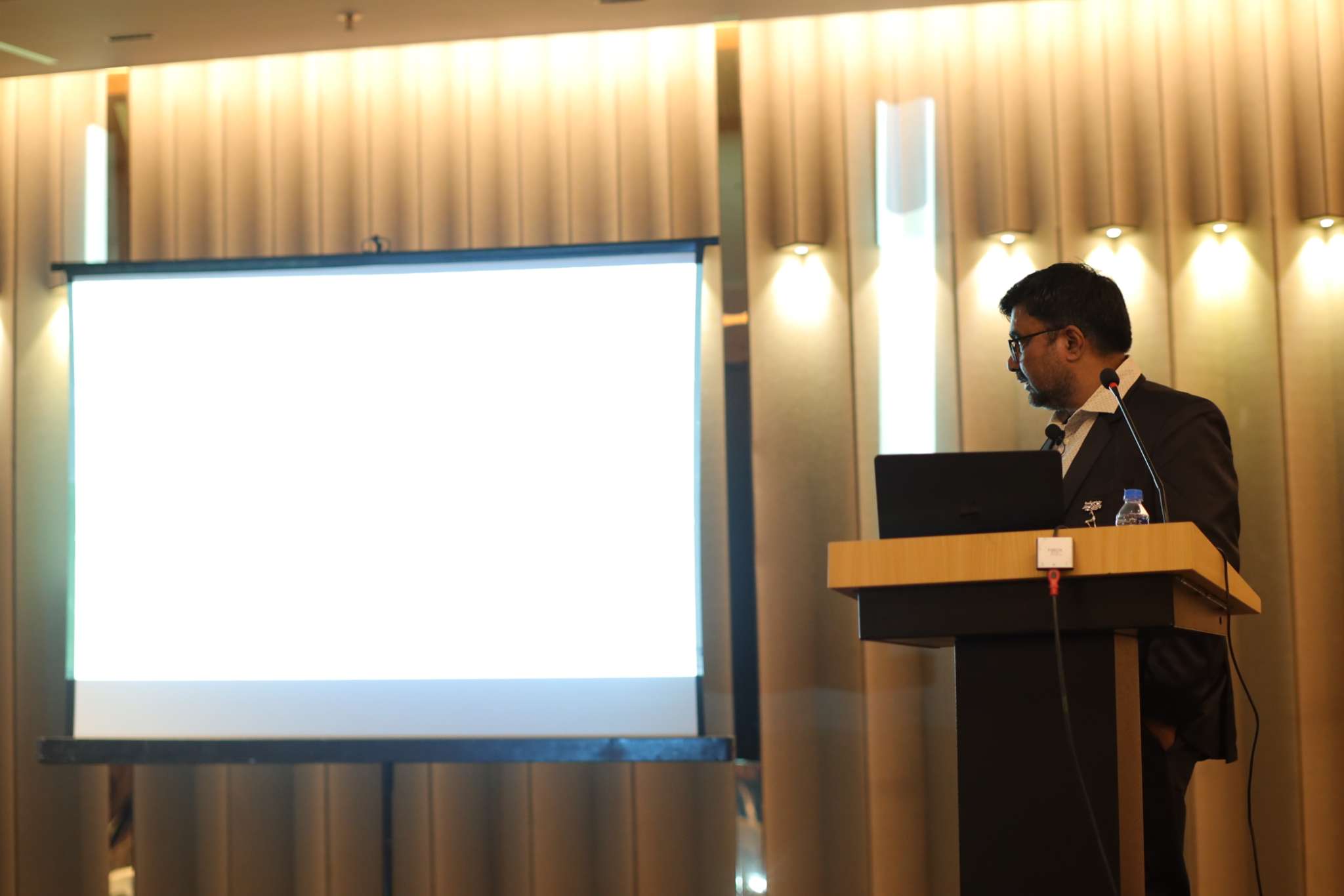 Mr. Ashok Holani is presenting a slideshow