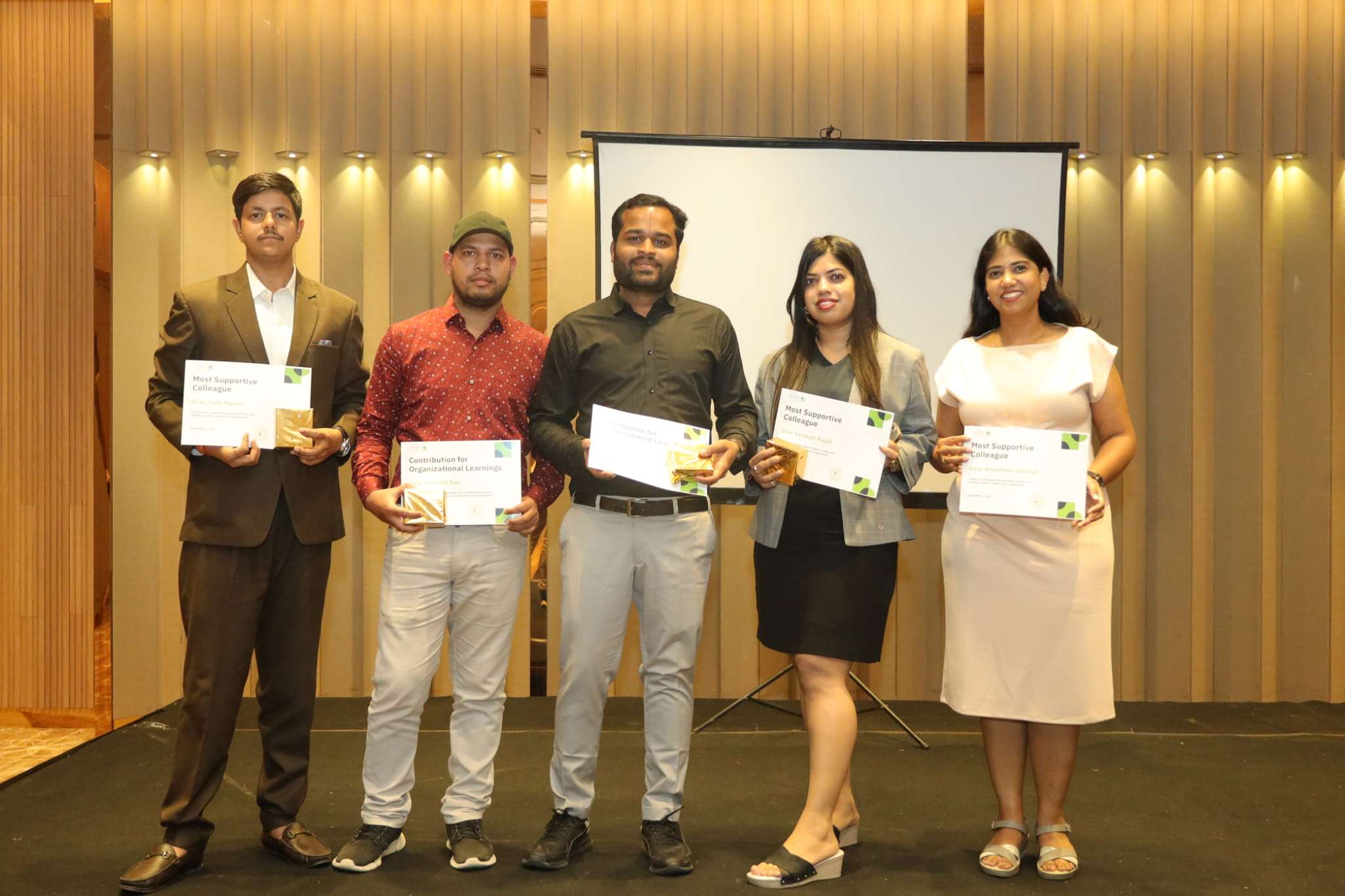 Recognized team members with their awards